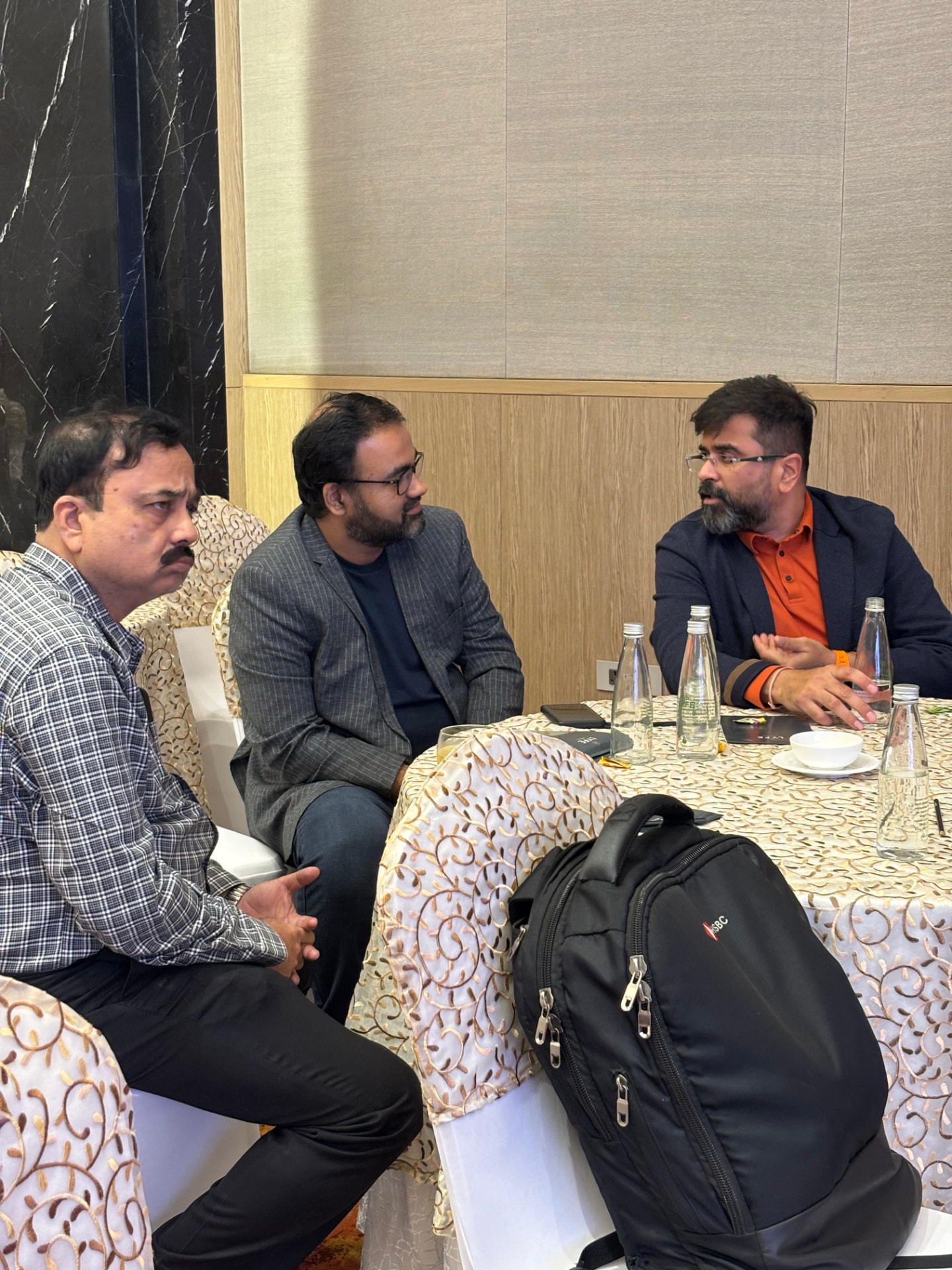 Guests in conversation with a speaker at UDAAN 2025